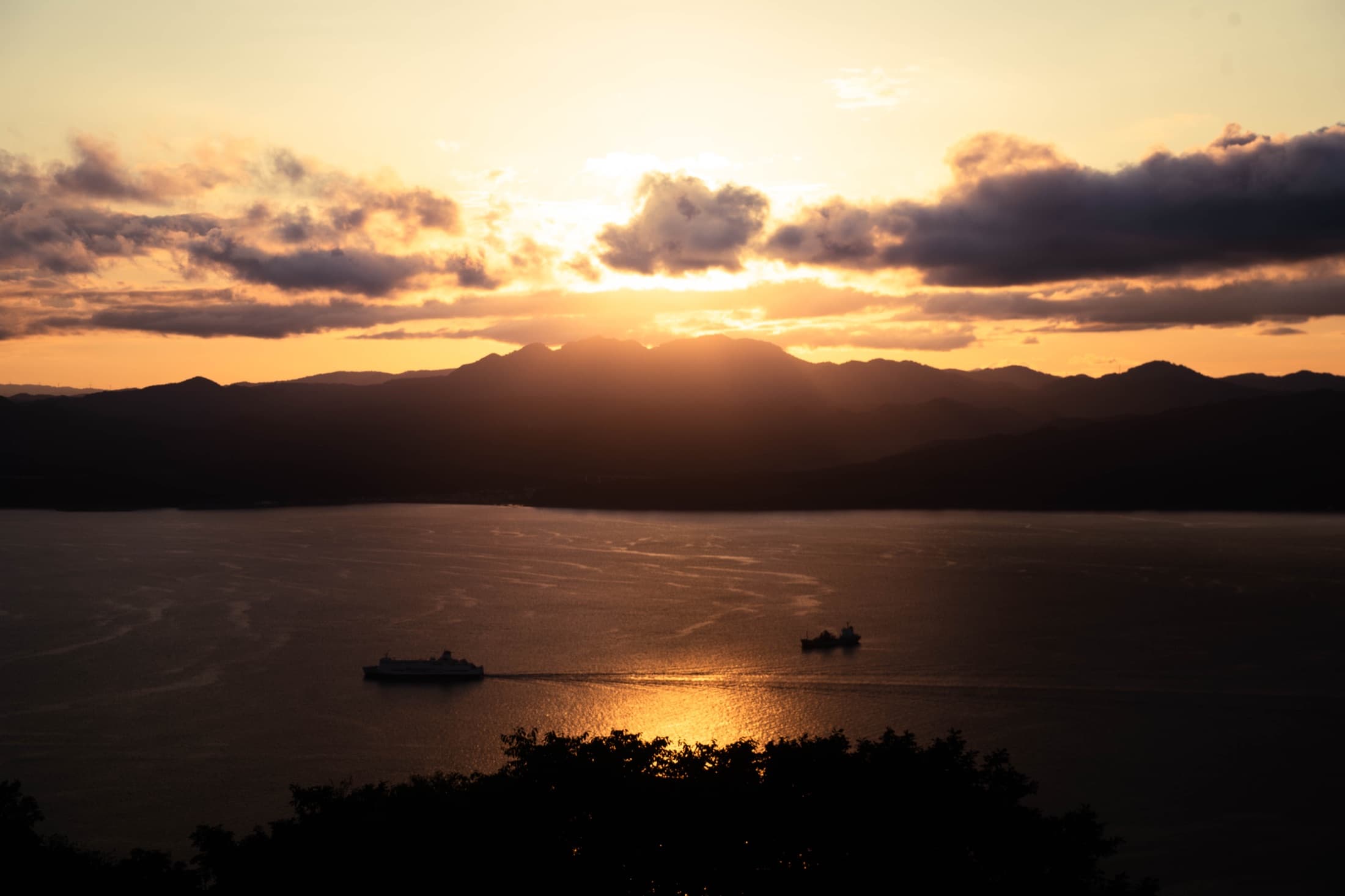 Ferries crossing Hakodate Bay at sunset, seen from Mount Hakodate.
