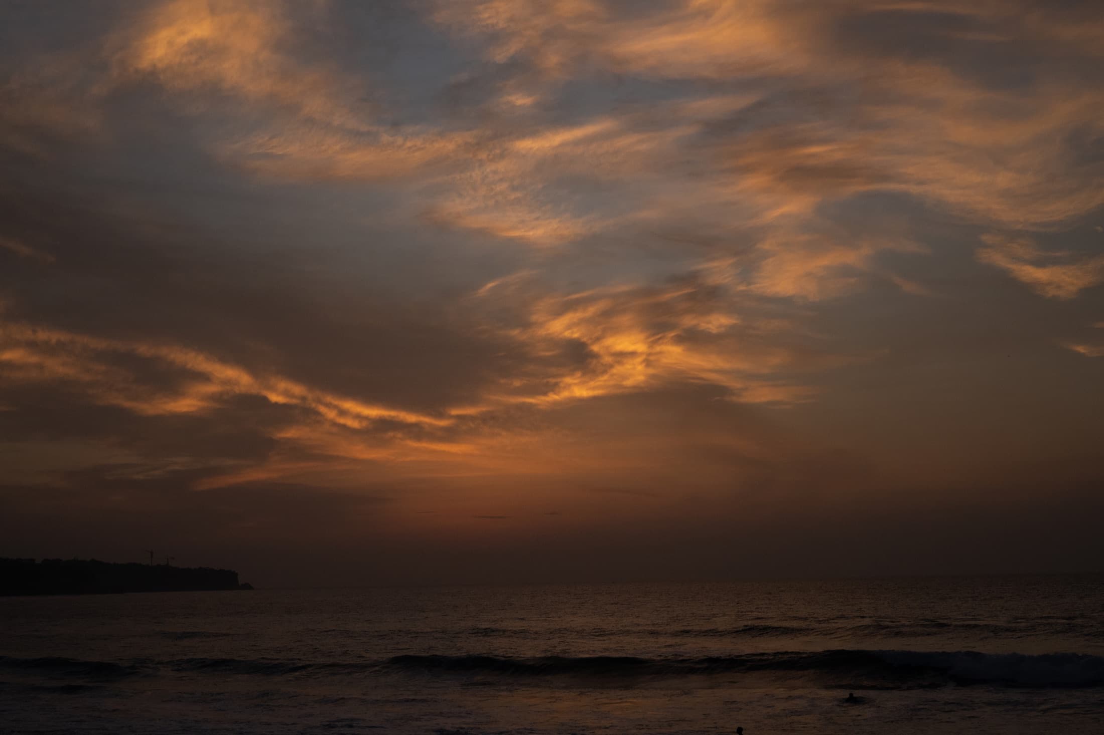 Cirrus clouds catching the last light over the Indian Ocean, Bali.
