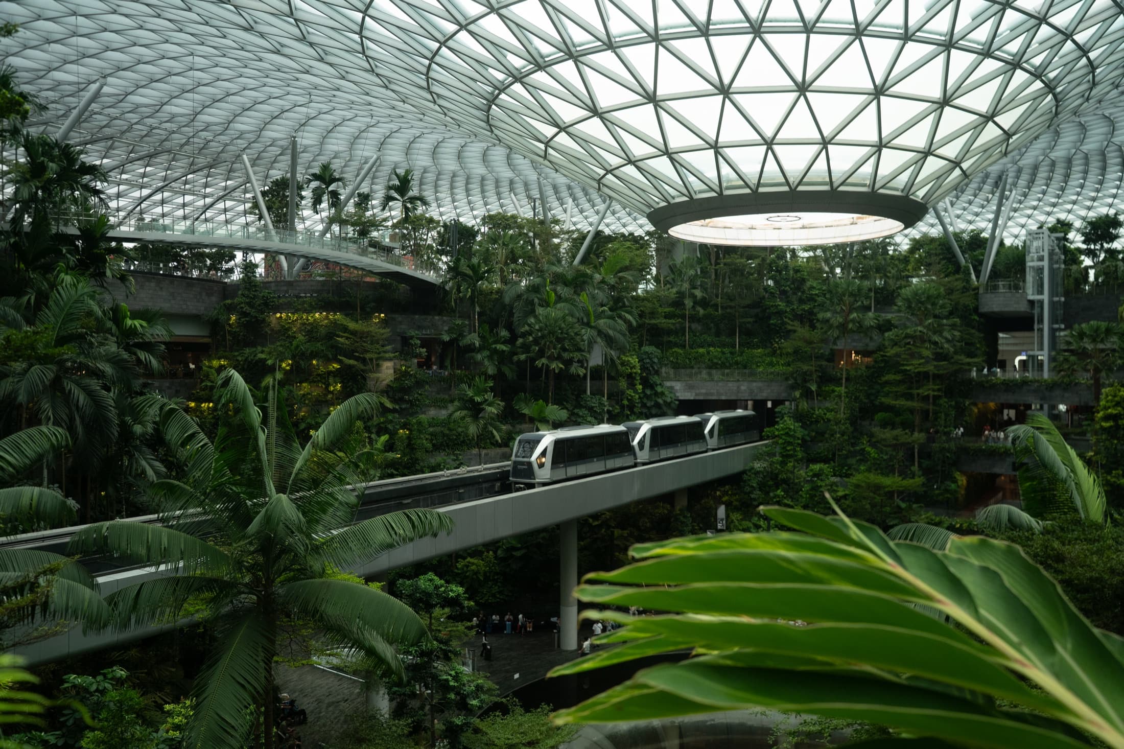Monorail crossing inside the Jewel at Singapore Changi Airport.