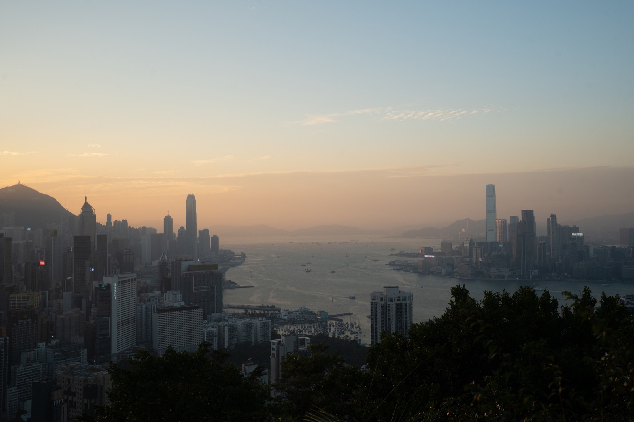 Victoria Harbour and Hong Kong Island skyline from Sir Cecil's Ride at dusk.